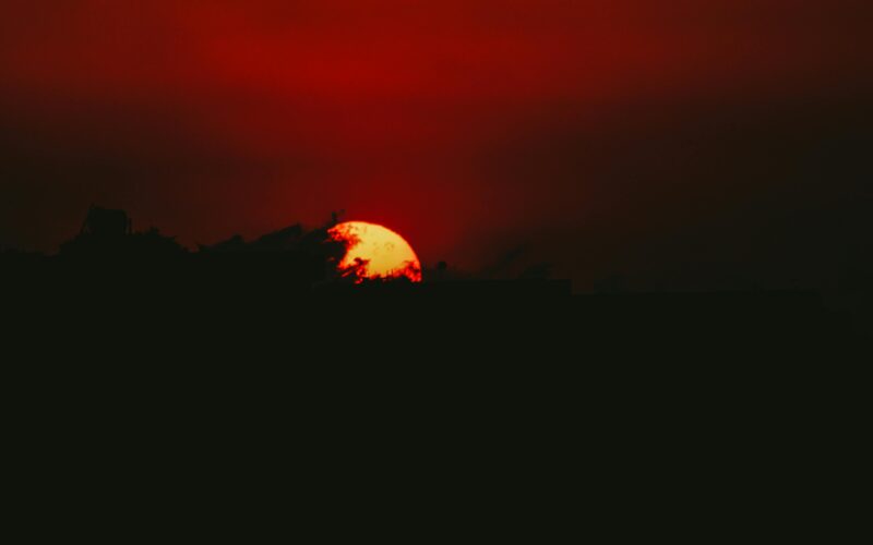 A stunning silhouette against a dramatic sunset in Aaqrabâte, Idlib, Syria.